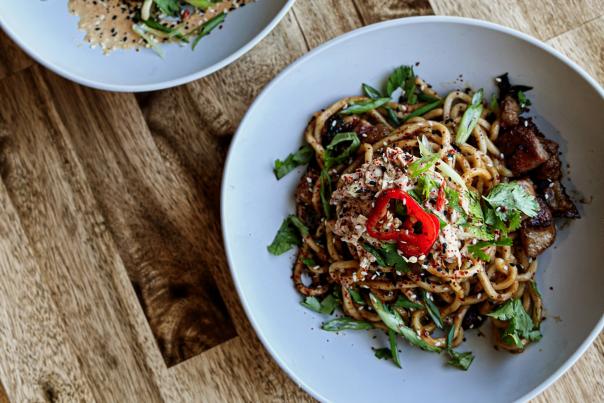 Get in my Belly and I Love Plumm Noodle dishes at Clever Ale House on a table