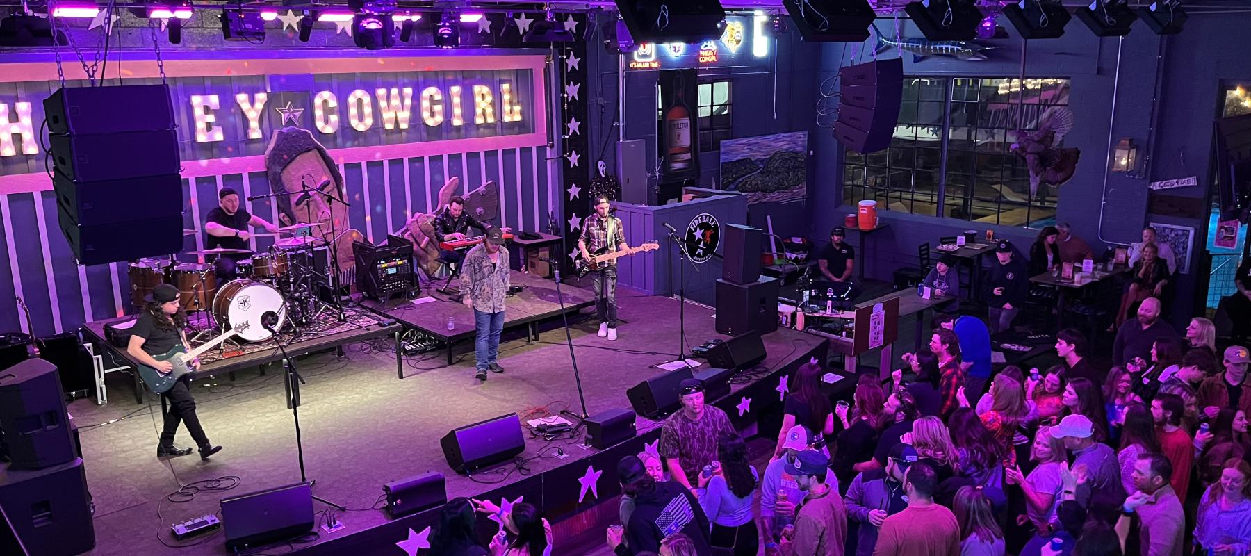 A country band performing live to an audience.